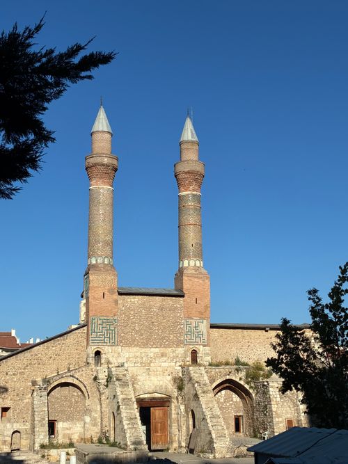 Free A striking view of the double minaret Medrese, showcasing historic architecture in Sivas, Turkey. Stock Photo