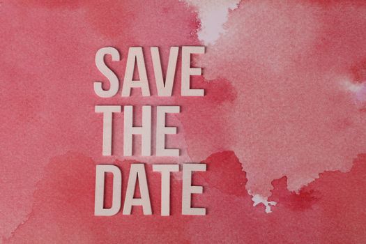 Elegant pink watercolor background with 'Save the Date' text for invitations.