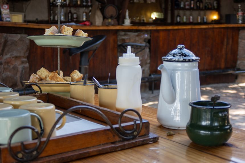 Rustic cafe table with coffee and pastries — photo by Magda Ehlers on Pexels