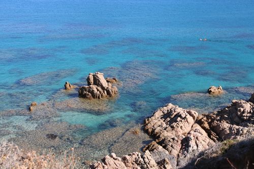 Free Stunning view of rocky formations in clear turquoise sea under bright sunlight. Stock Photo
