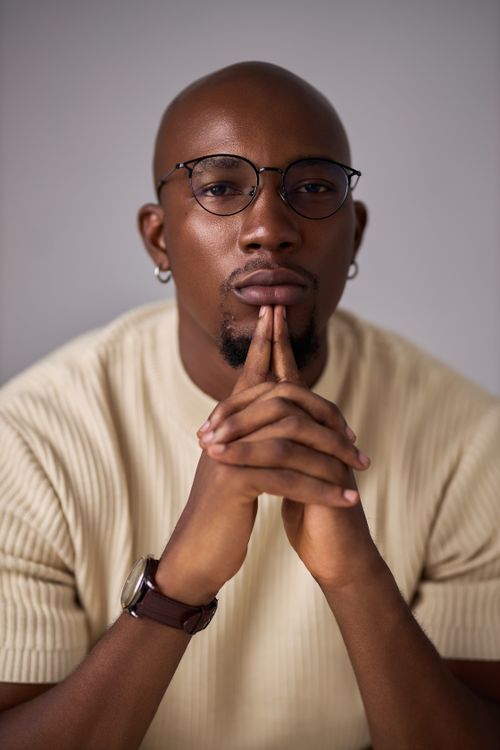 Free Close-up portrait of an adult wearing glasses, deep in thought. Stock Photo