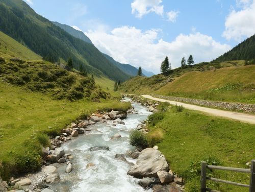 Free Beautiful alpine landscape with a flowing stream in Trentino-Alto Adige, Italy. Stock Photo