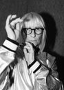 Old woman in eyeglasses and stylish jacket