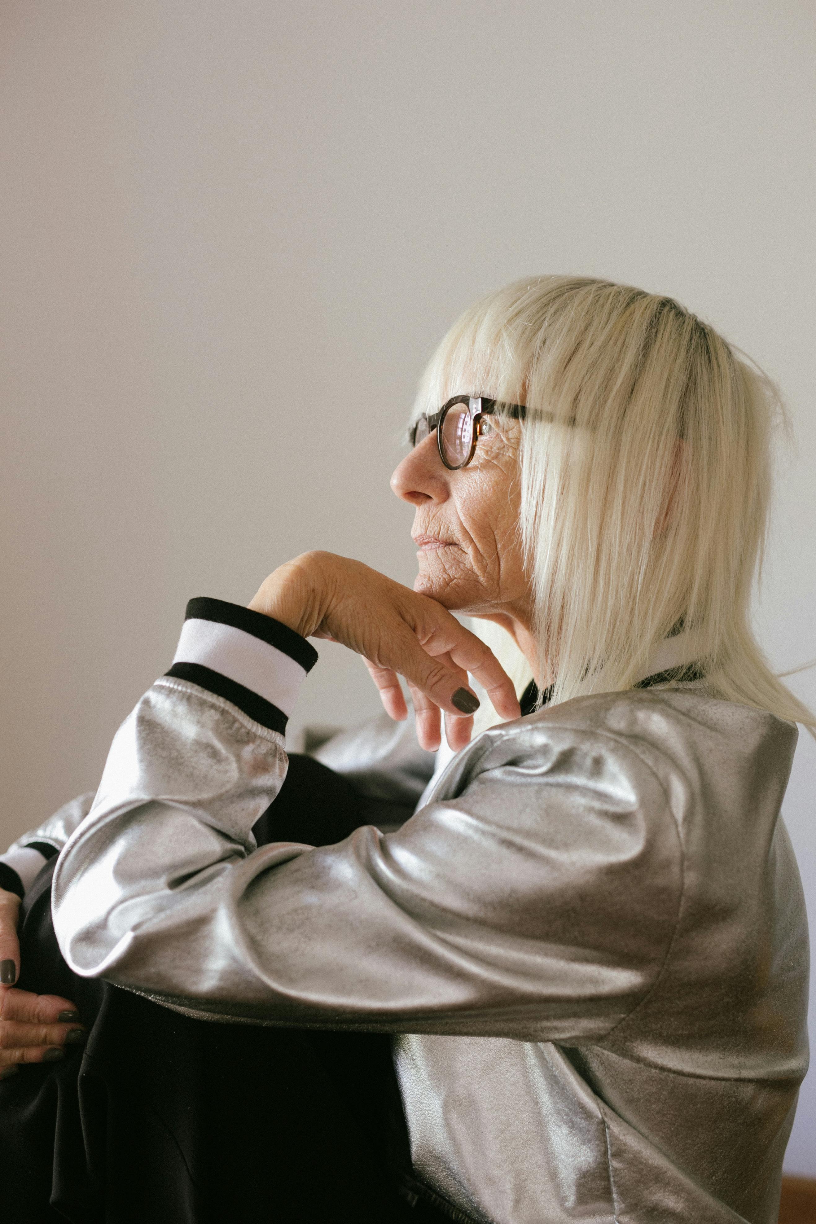 Elderly woman in eyeglasses and trendy bomber. | Photo: Pexels