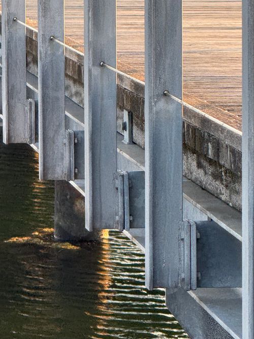 Free Detailed metallic architecture of a bridge near Plön, Germany highlighting structure at sunrise. Stock Photo