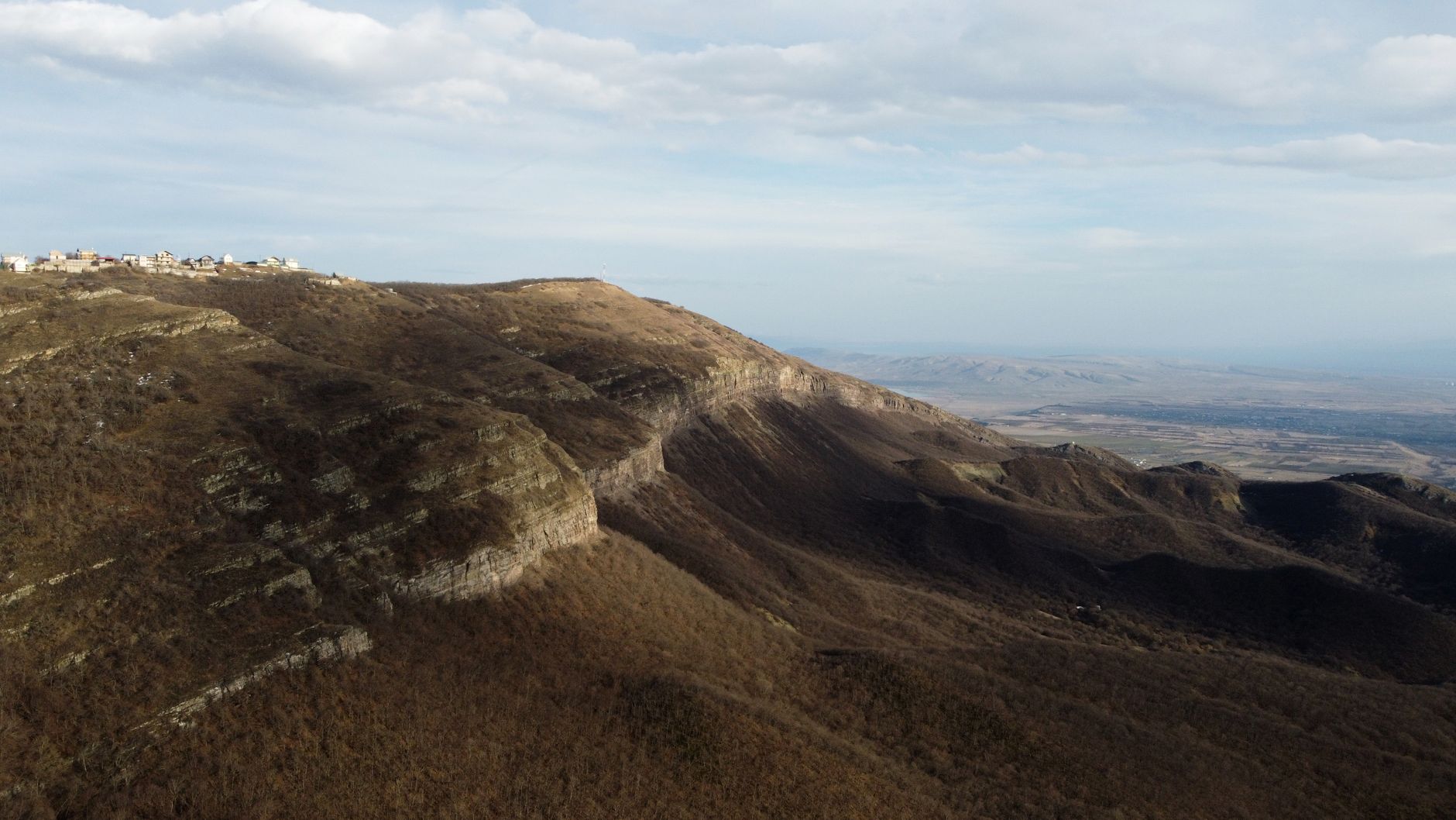 Explore the vast mountain wilderness and rocky ridges near Tbilisi, Georgia, captured in stunning aerial view. โ photo by Alexander Gluschenko / Pexels