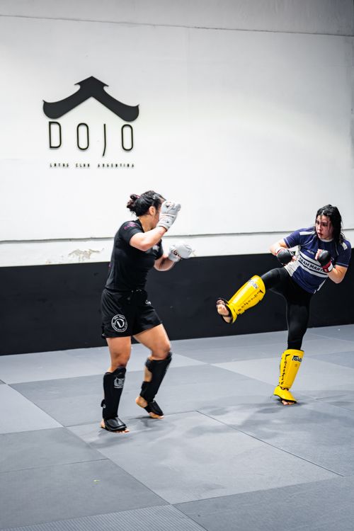 Free Two women practice kickboxing at a dojo in Buenos Aires, illustrating martial arts training in action. Stock Photo