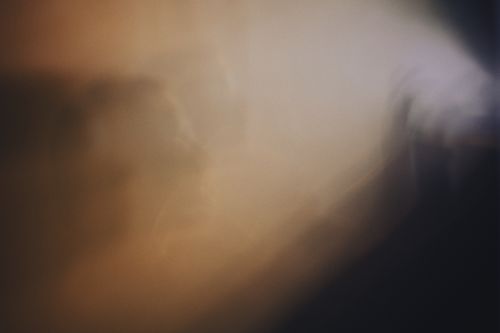 Free Evocative abstract image featuring a mysterious muted light and shadow play creating a liminal space feeling. Stock Photo