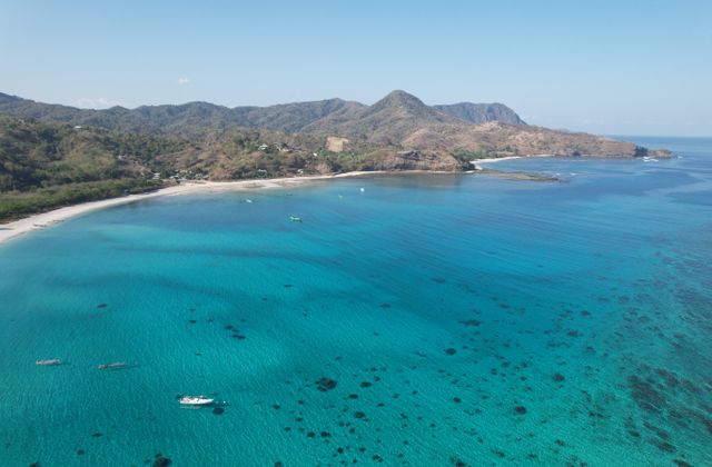 A breathtaking aerial view of the clear turquoise waters and coastline of Lombok, Indonesia. — arriving in Lombok