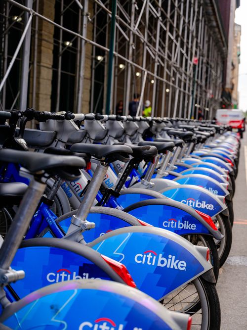 Free A long line of blue Citi Bikes neatly parked on a New York City street. Stock Photo