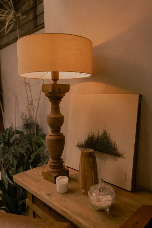 Free Warmly lit wooden lamp with rustic decor in an inviting and cozy interior setting. Stock Photo