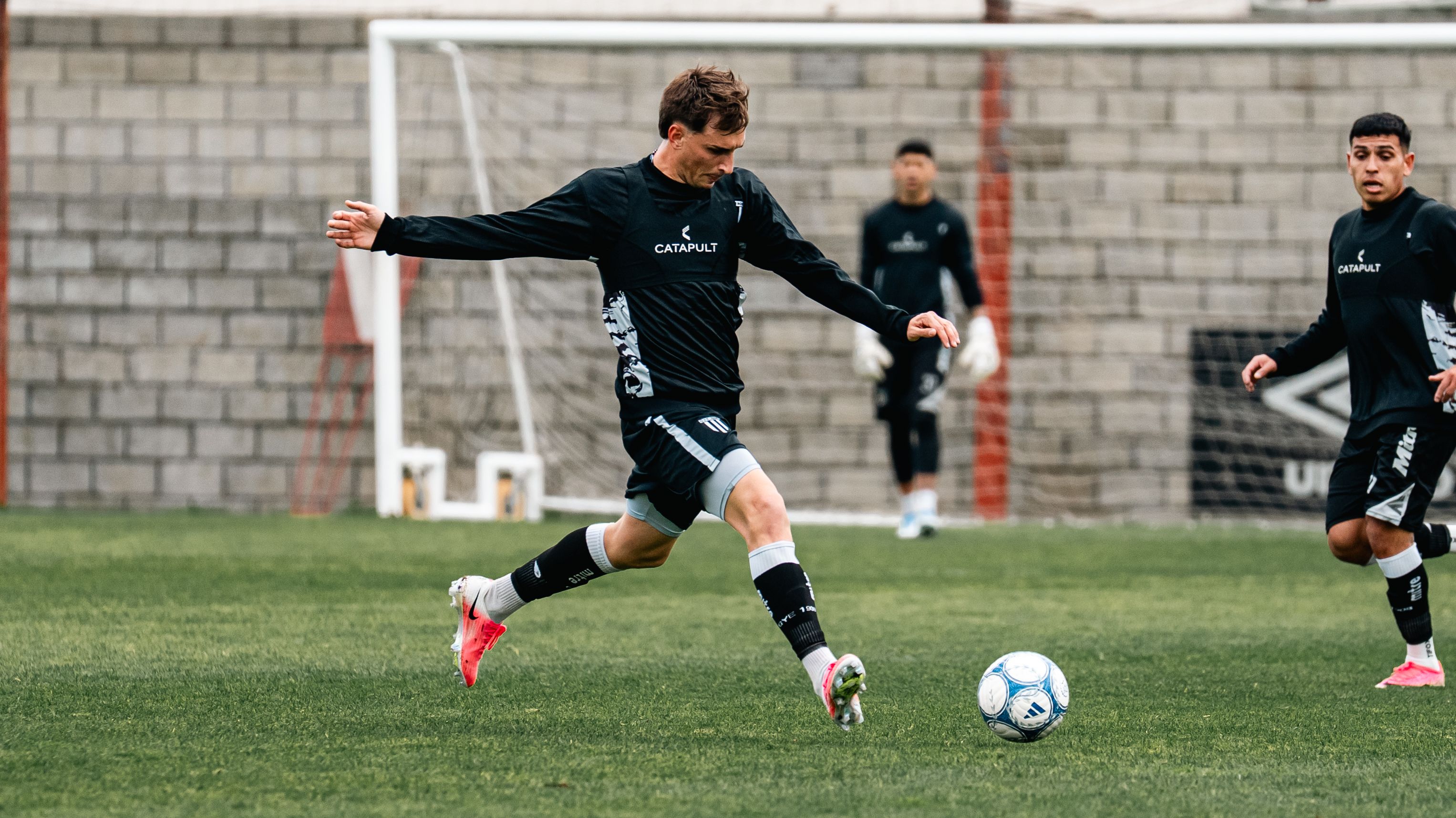 Ruben Neves controlling the ball in a deep-lying playmaker position during a match.