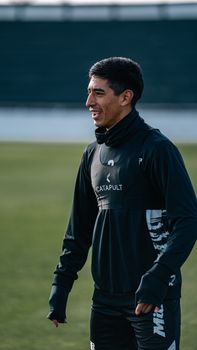 Athlete preparing for a soccer match during outdoor training session.