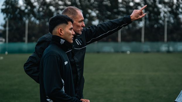 coach talking athlete