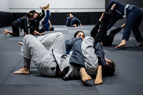 Free Martial arts practitioners in action during a Brazilian Jiu-Jitsu class in Buenos Aires, Argentina. Stock Photo