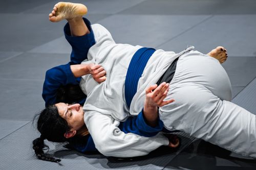 Free Two women engage in a grappling match during martial arts training in Buenos Aires. Stock Photo