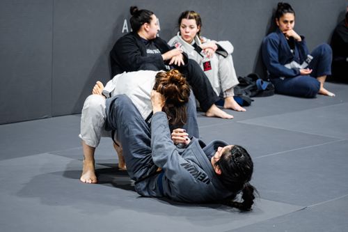 Free Group of women training Brazilian Jiu-Jitsu at a martial arts gym in Buenos Aires. Stock Photo