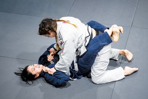 Free Two women practicing Brazilian Jiu-Jitsu on a gym mat in Buenos Aires. Stock Photo