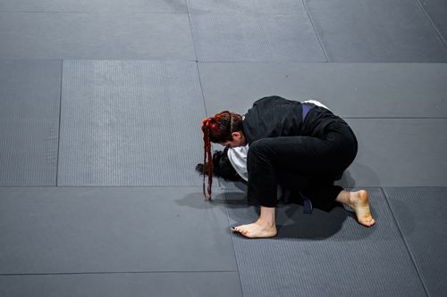 Free Two martial artists engage in training on a mat, showcasing skillful moves and technique. Stock Photo