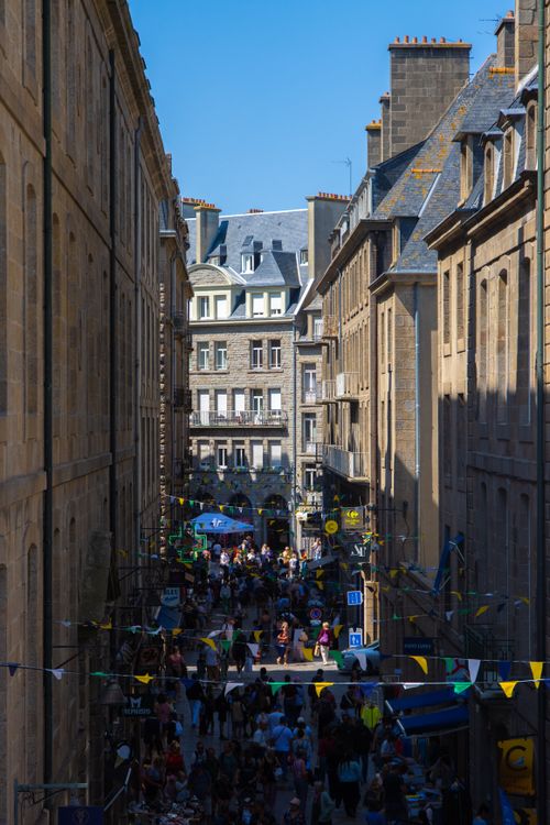 Free Crowded street in Saint-Malo, Brittany, France, under bright sunlight. Stock Photo