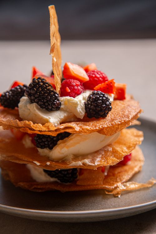 Free Delicious layered pastry with blackberries and strawberries. Perfect for dessert lovers. Stock Photo