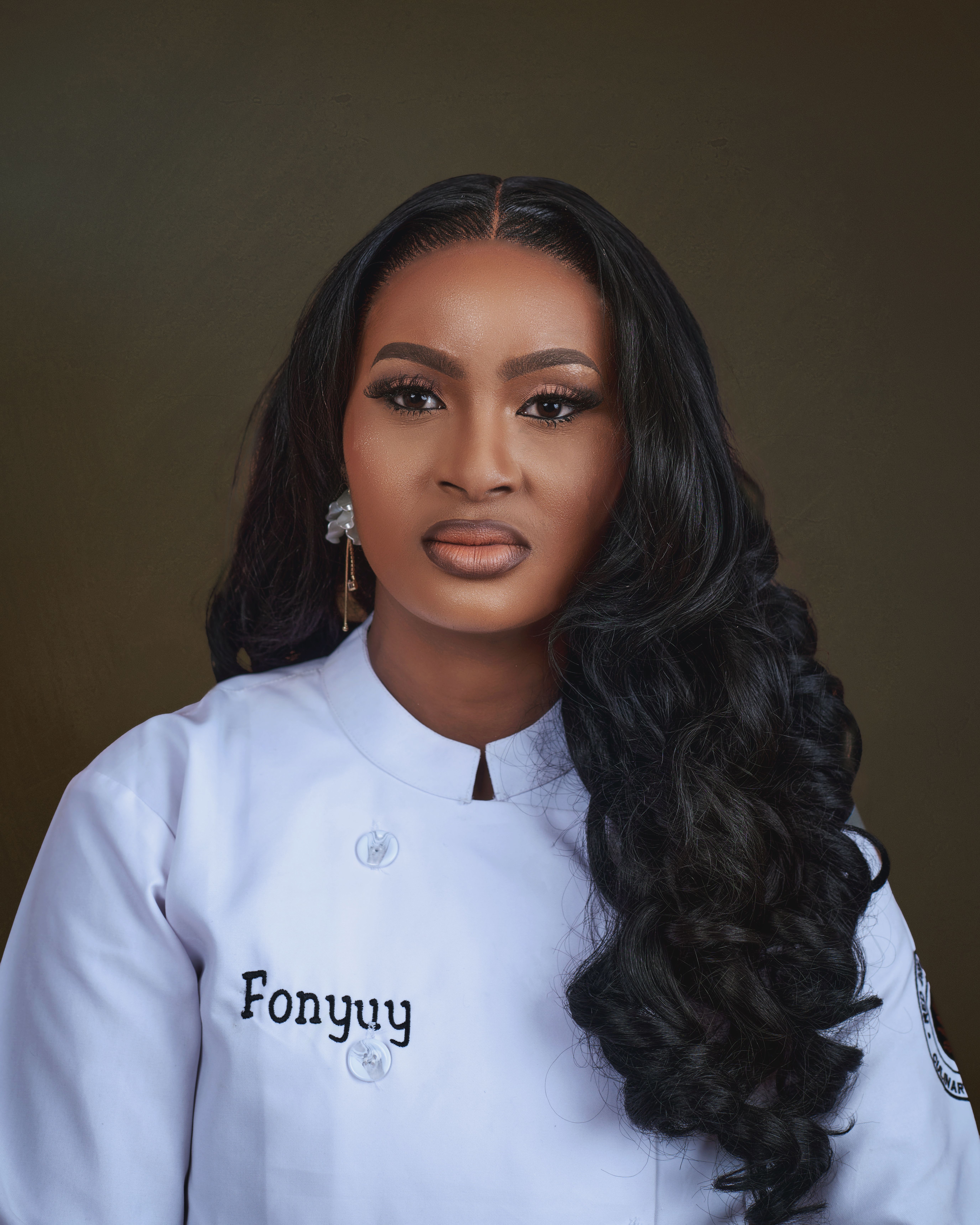 Portrait of a female chef wearing a white coat with intricate makeup. Ideal for culinary themes.