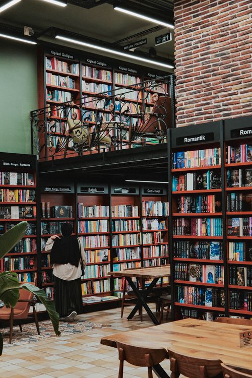 Free A welcoming bookstore with shelves full of diverse books and cozy reading spaces. Stock Photo