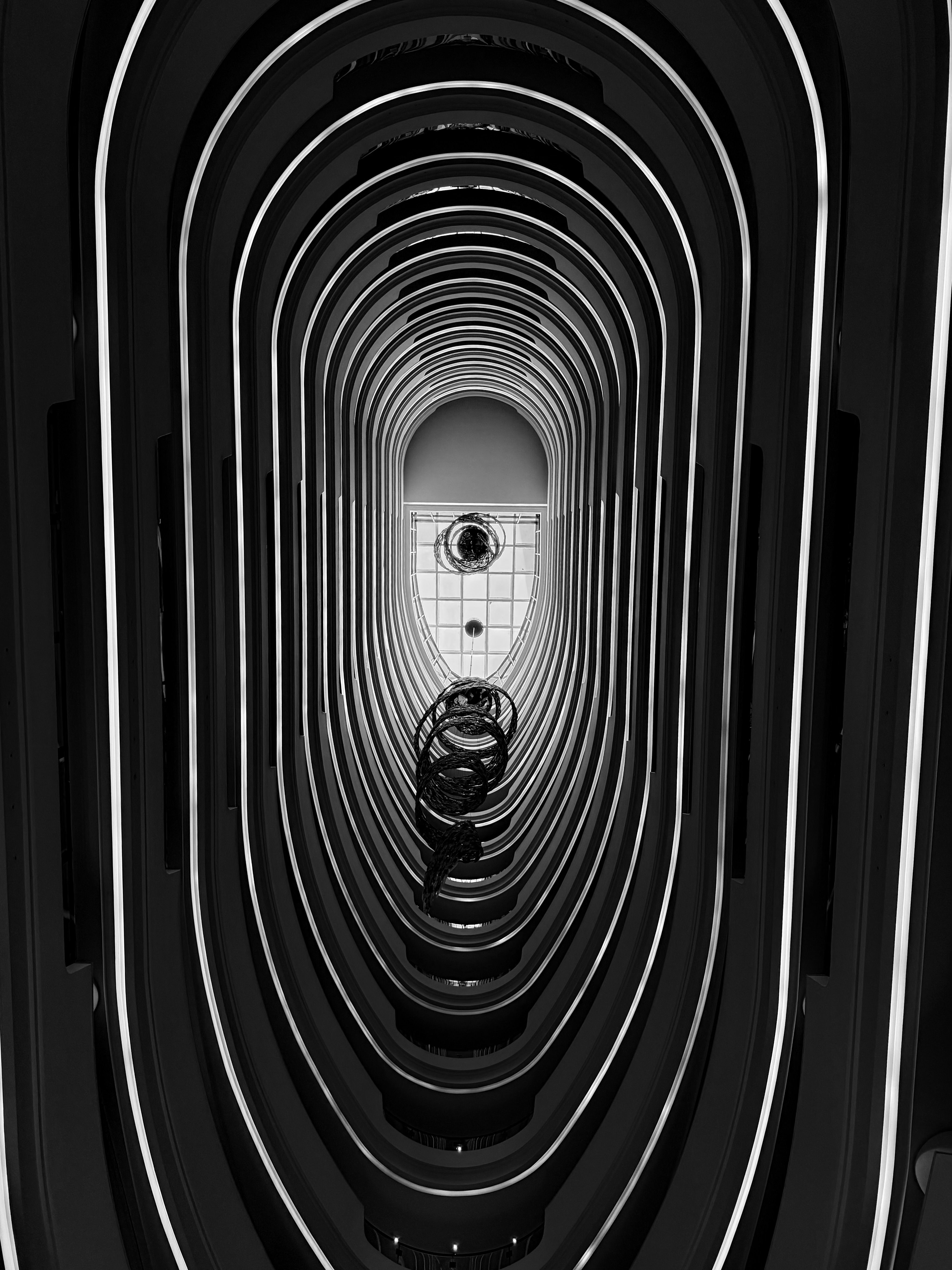 Intricate architectural tunnel design captured in monochrome for a modern, abstract appeal.