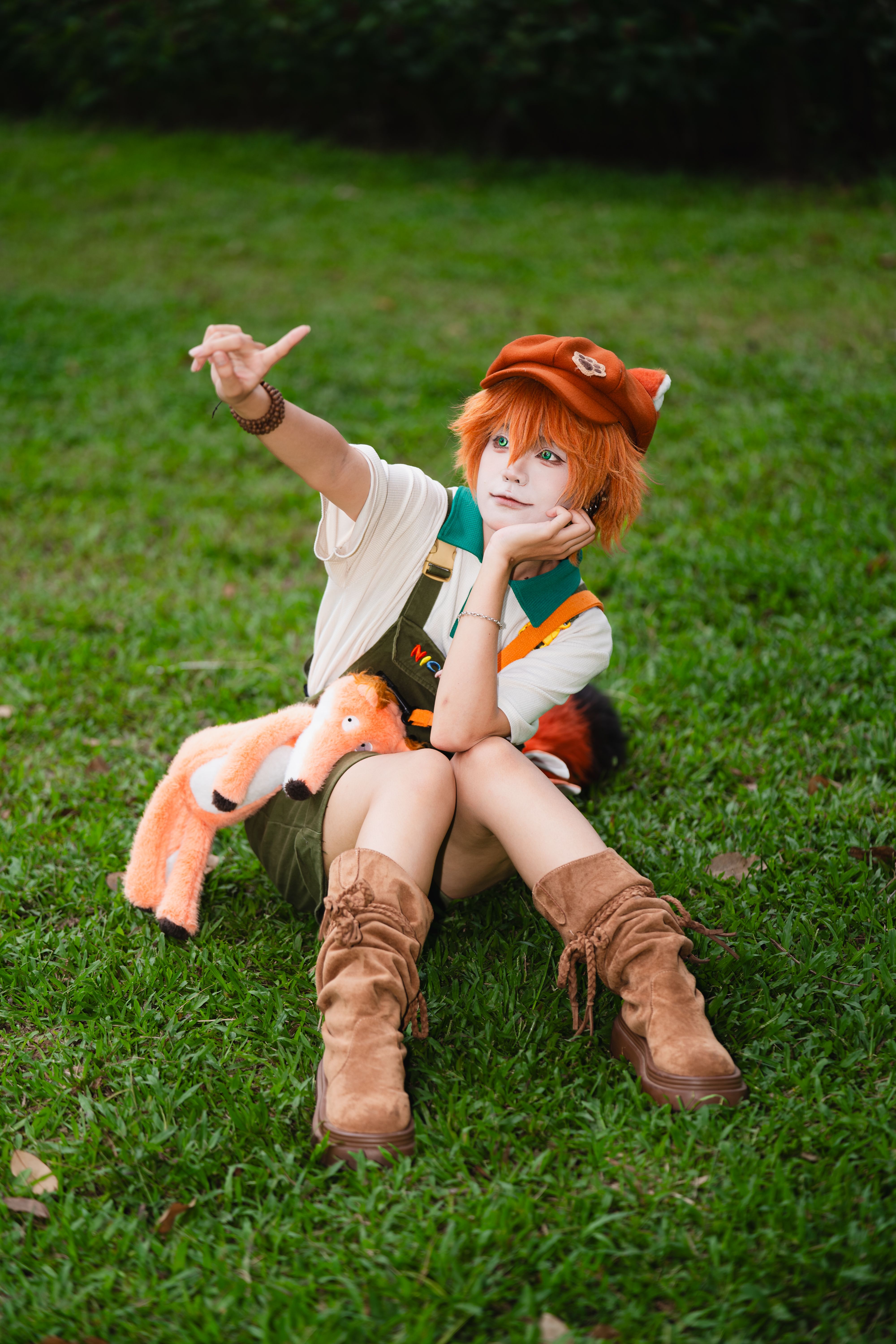 Cosplayer with Plush Toy on Grass Outdoors