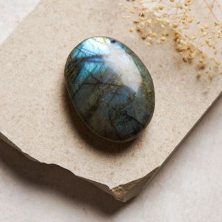 Polished labradorite stone with blue-green flash, photo by Natalie Goodwin on Pexels