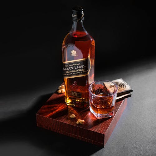 A Bottle of Black Label on a Wooden Board