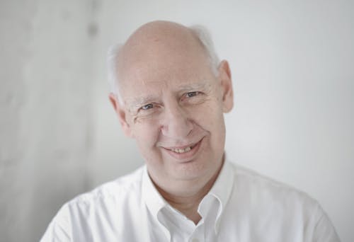 Elderly Man in White Dress Shirt Smiling