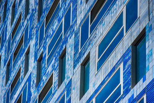 Free Dynamic blue mosaic facade of a modern building in Utrecht, Nederland, showcasing contemporary architecture. Stock Photo