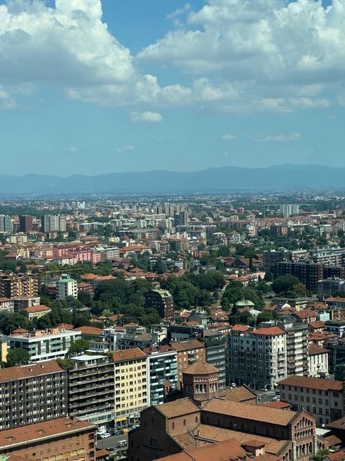 Free A beautiful aerial view of Milan, showcasing architecture and urban layout under a bright blue sky. Stock Photo