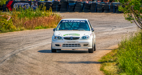 Free Explore the thrilling rally race scene in Ritsona, Greece with this dynamic shot of a race car. Stock Photo