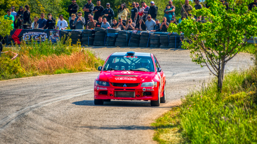 Free A thrilling rally race car speeds through a vibrant outdoor race track in Ritsona, Greece. Stock Photo