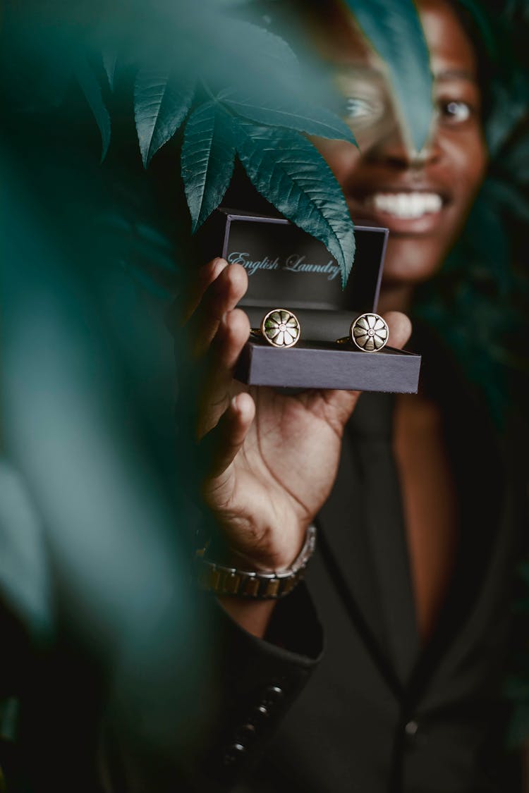 Person Holding Cufflinks