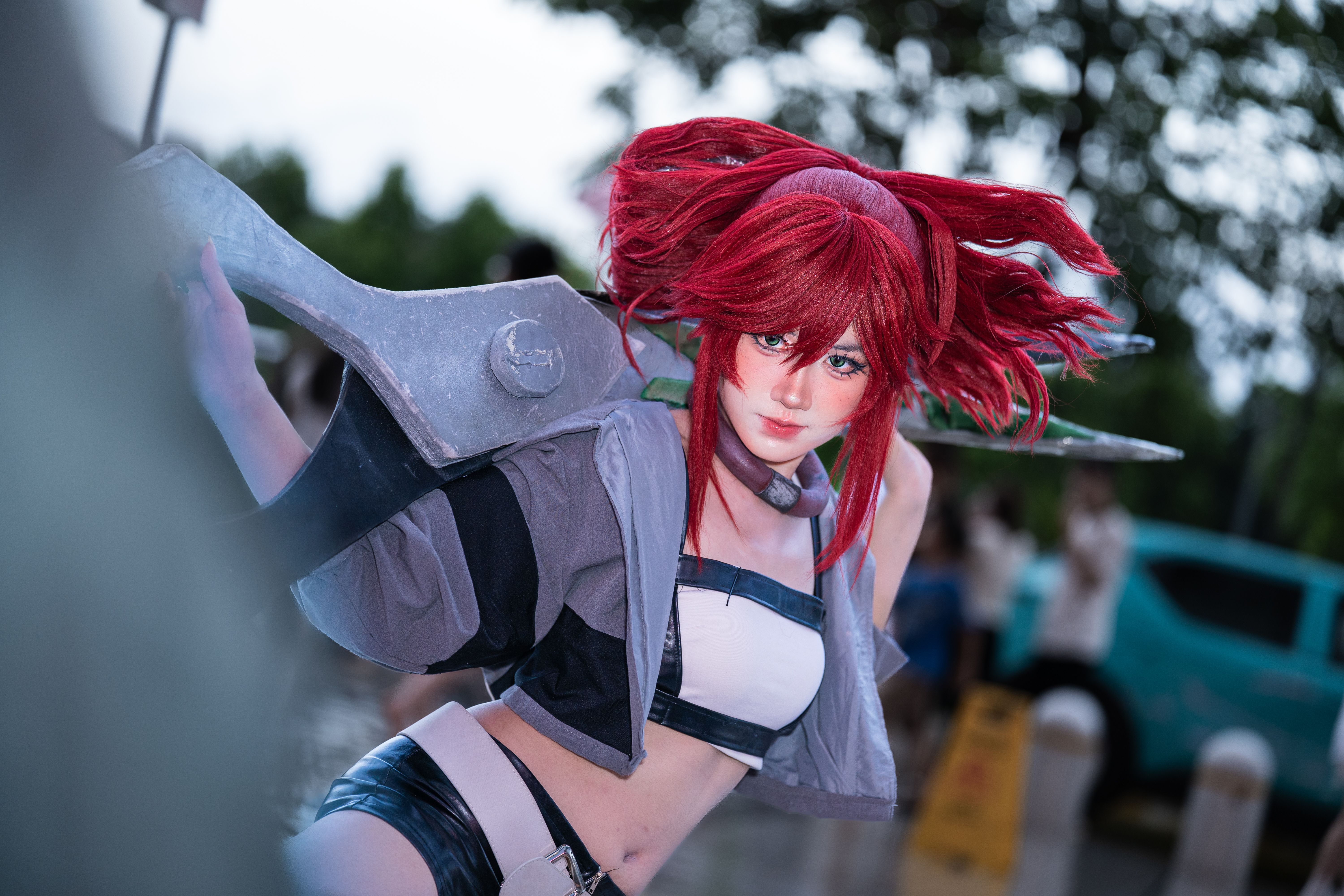 Dynamic Cosplay with Metallic Props Outdoors