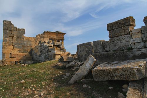 Free Explore historic stone ruins with a clear blue sky backdrop. Stock Photo