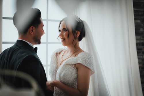 Free Bride and groom share a heartfelt moment during their wedding in Ankara. Stock Photo