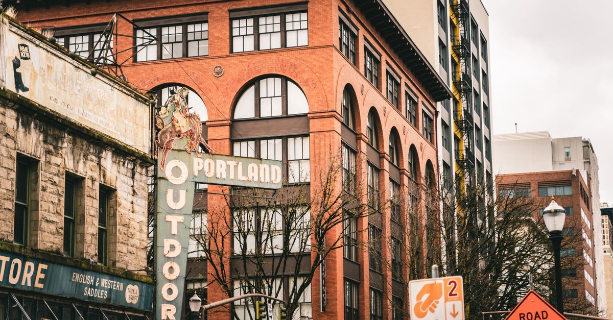 Street view capturing Portland's historic building facade with signage.