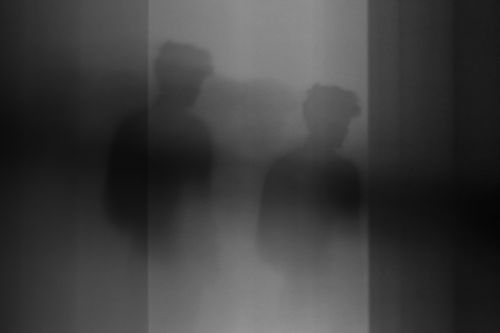 Free Abstract black and white photo featuring a shadowy silhouette, creating an enigmatic atmosphere. Stock Photo