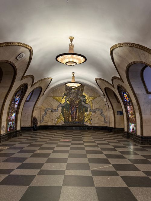 Free Elegantly decorated metro station featuring intricate stained glass and mosaic artwork. Stock Photo