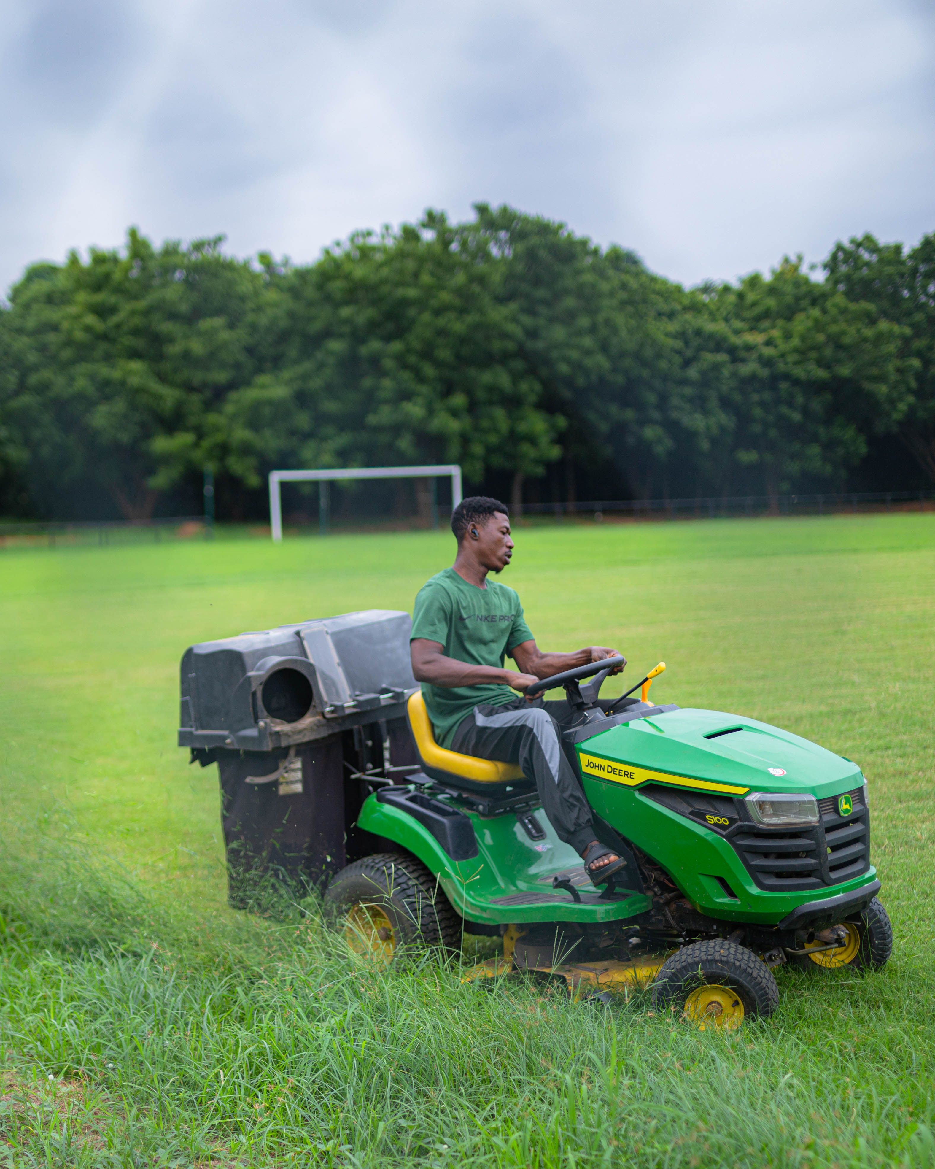 Gardener mowing a lawn on a home in Blackheath SE3