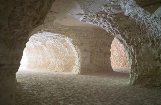 Explore light-filled sandstone caves with unique textures and curves.