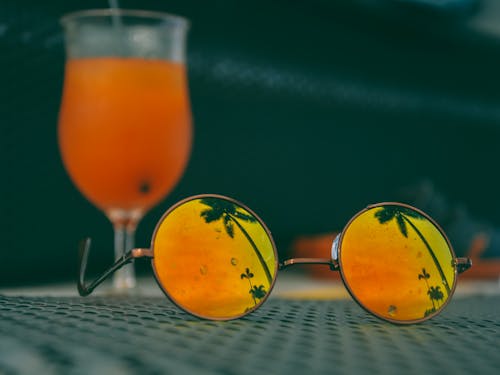 Free Orange Sunglass on the table Stock Photo