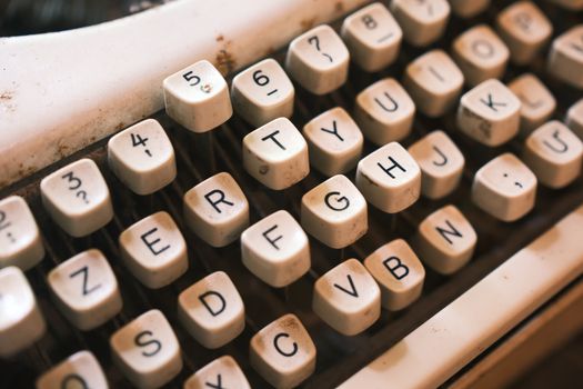 Close-up view of vintage typewriter keys, highlighting their retro charm and tactile texture.