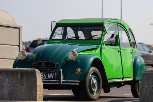 Free A classic green Citroën 2CV parked outdoors in Saint-Malo, capturing a nostalgic vintage feel. Stock Photo