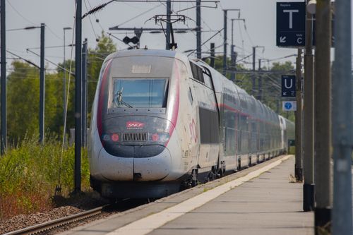 Free High-speed train arriving at a rural station in Dol-de-Bretagne, Brittany, France. Stock Photo