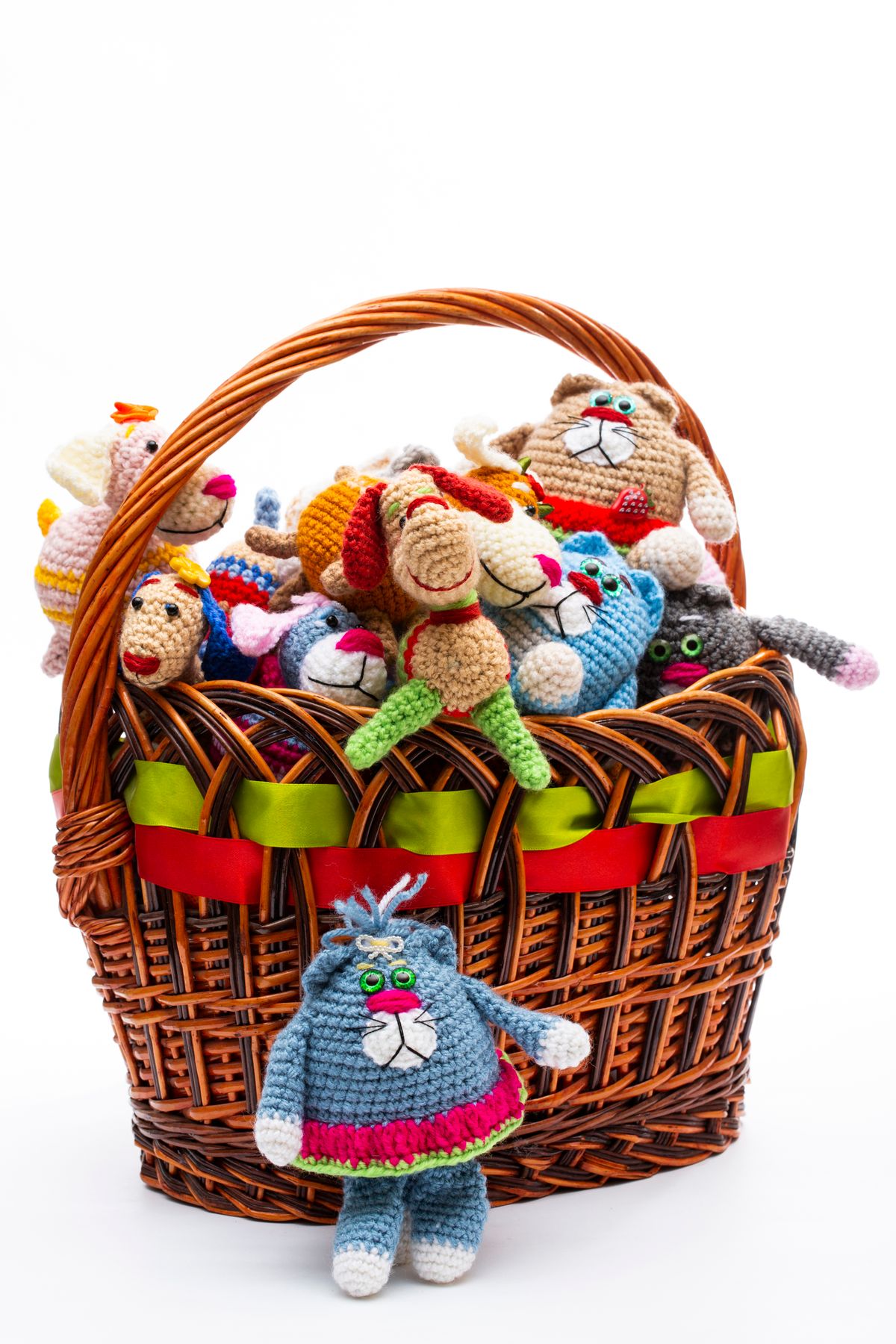 Wicker basket holding handmade crocheted dolls